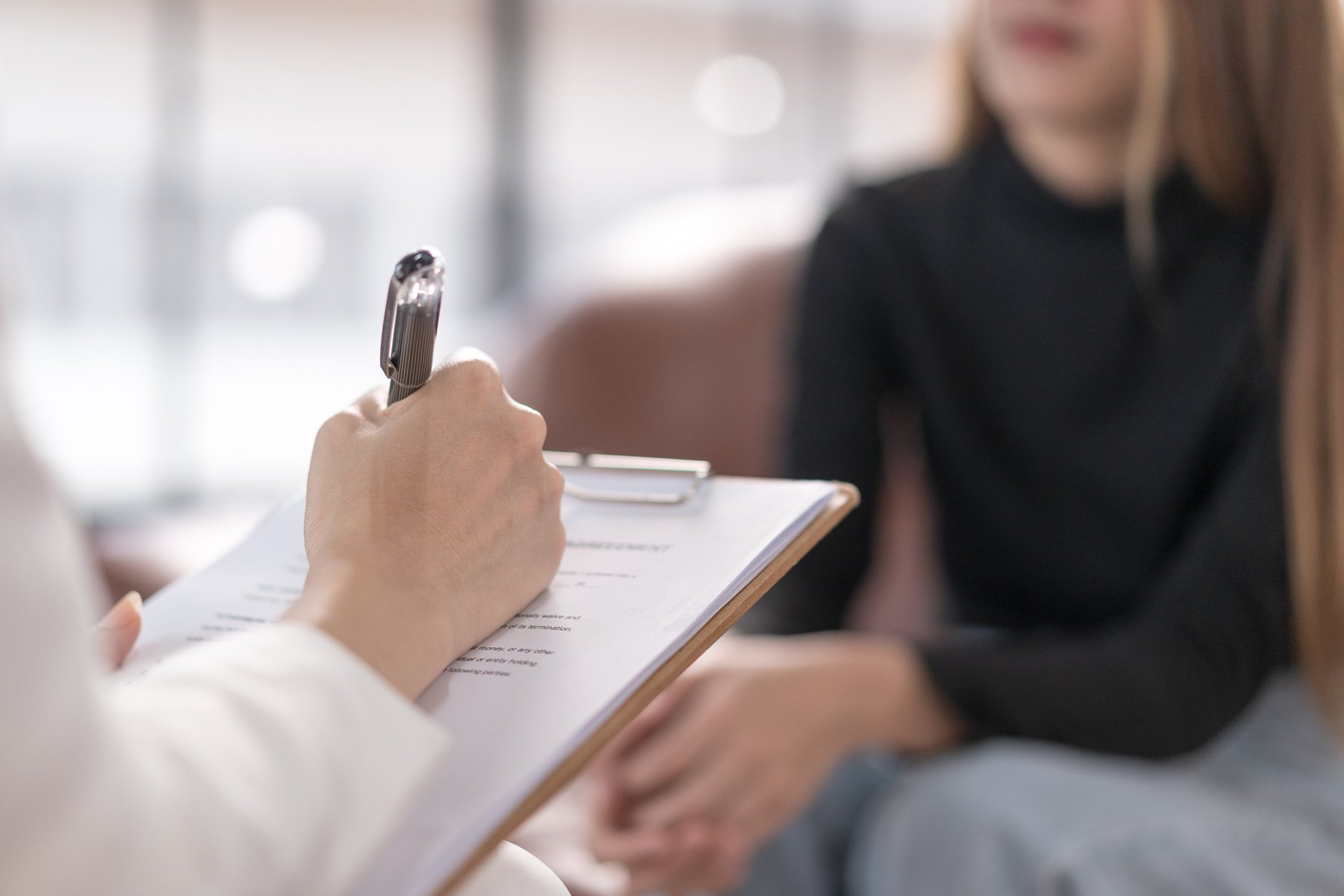 Woman in Counseling Session with Psychologist